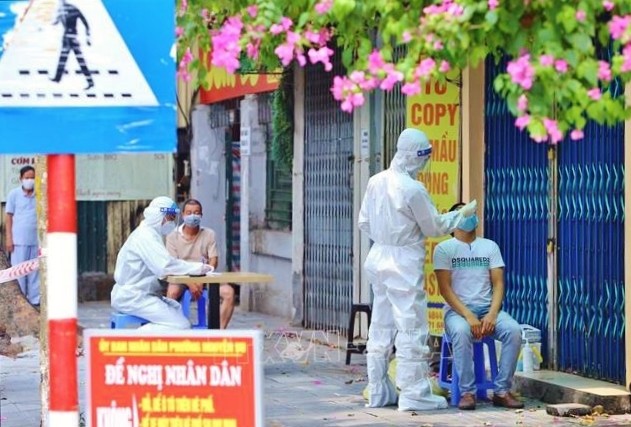 วันที่ 26 กรกฎาคม เวียดนามพบผู้ติดเชื้อโรคโควิด-19 รายใหม่ 7,882  ราย - ảnh 1