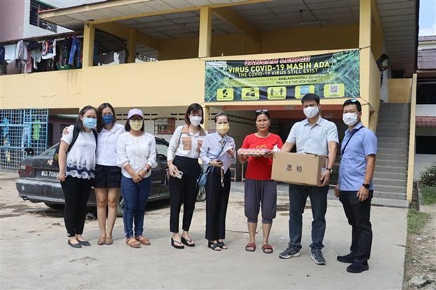 ช่วยเหลือชาวเวียดนามในมาเลเซียที่ได้รับผลกระทบจากอุทกภัย - ảnh 1