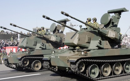 Japan’s ruling coalition approves new rules on arms exports - ảnh 1