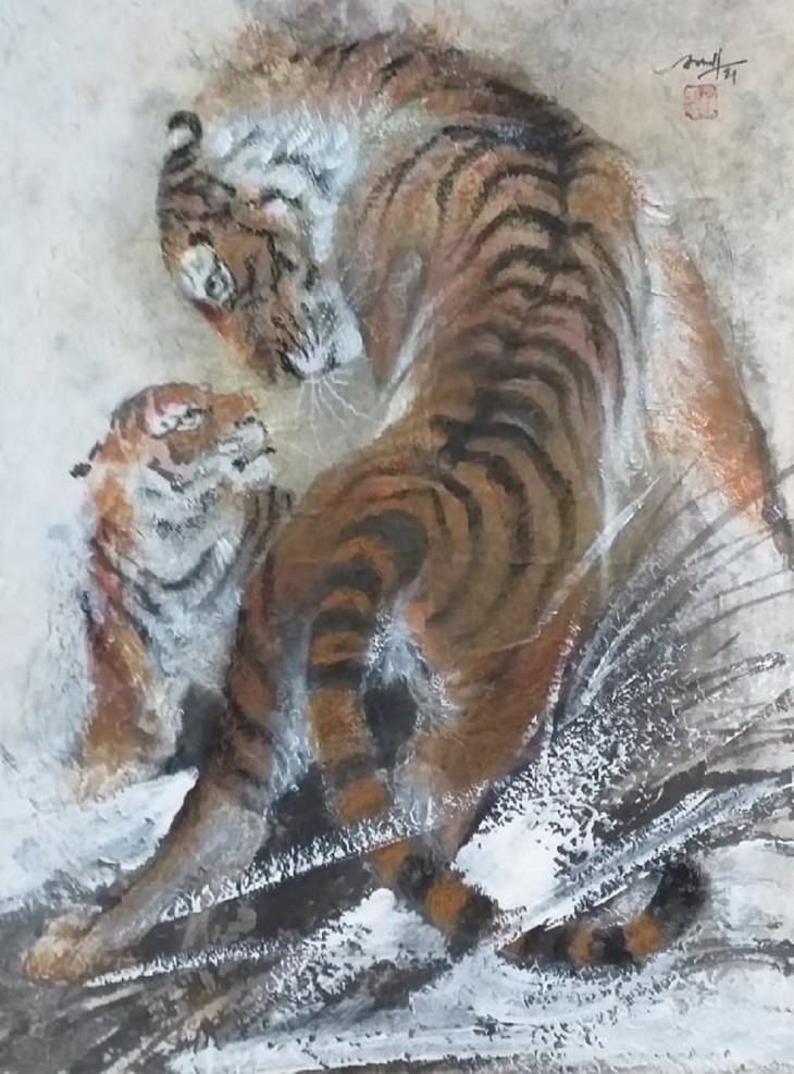 Lively paintings by Nguyen Doan Ninh to usher in Year of the Tiger - ảnh 10
