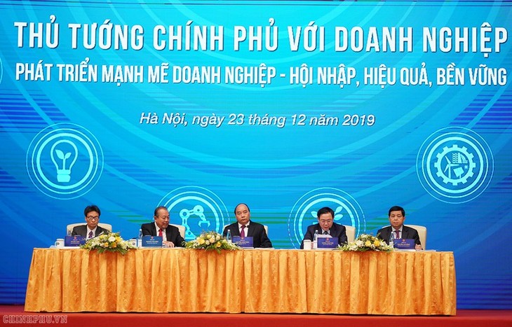 PM vows to minimize risk for businesses - ảnh 1