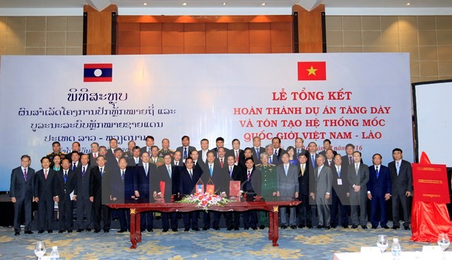 Closing ceremony of project to reinforce border markers between Vietnam and Laos - ảnh 1