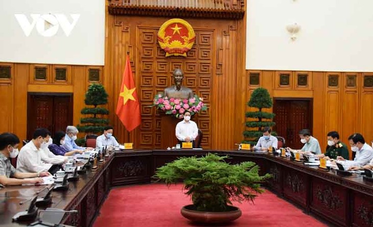 Premierminister Pham Minh Chinh leitet Konsolidierung des nationalen Verwaltungsstabes zur COVID-19-Bekämpfung - ảnh 1