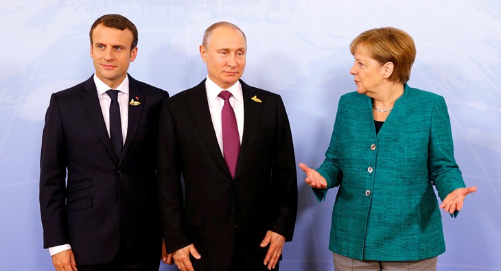 Échange téléphonique entre Emmanuel Macron, Angela Merkel et Vladimir Poutine  - ảnh 1