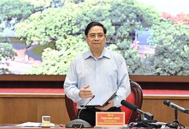 Фам Минь Тинь потребовал от города Ханоя придать приоритет противодействию COVID-19 - ảnh 1