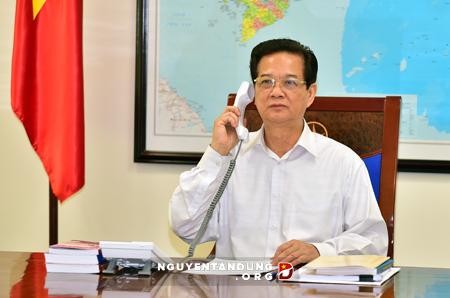 PM VN Nguyen Tan Dung melakukan pembicaraan via telepon dengan PM Australia, Tony Abbott - ảnh 1