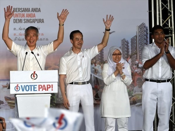Генсек ЦК КПВ поздравил премьера Сингапура с победой на парламентских выборах - ảnh 1