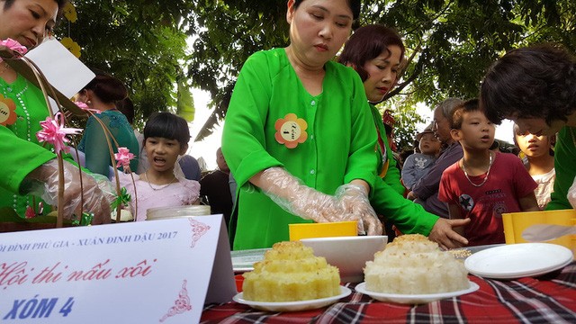 Своеобразный праздник клейкого риса в деревне Футхыонг - ảnh 4