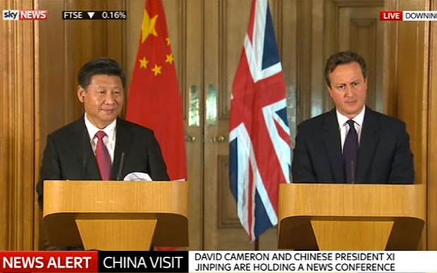 ประธานประเทศจีนเจรจากับนายกรัฐมนตรีอังกฤษ - ảnh 1