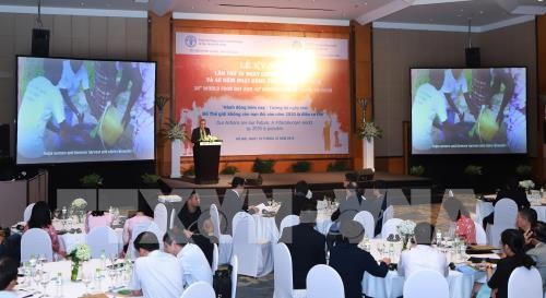 พิธีรำลึกครบรอบ 38 ปีวันธัญญาหารโลกและครบรอบ 40 ปีการปฏิบัติงานของ FAO ในเวียดนาม - ảnh 1
